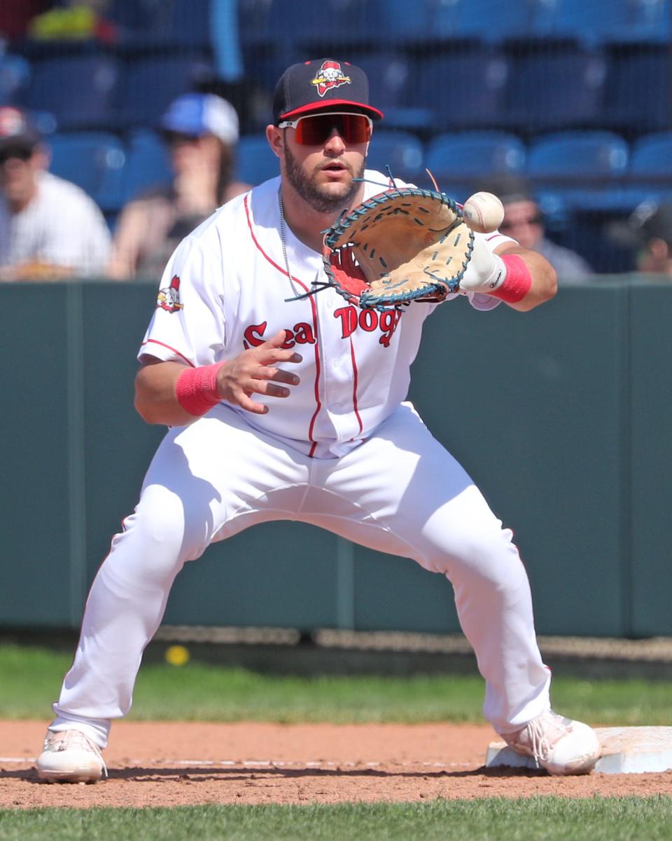 Niko Kavadas catches a ball at first base during a game for the Portland Sea Dogs during the 2023 season.