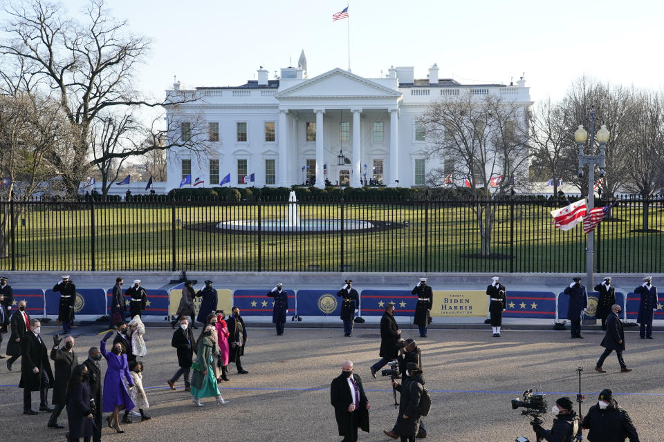 Vice President Kamala Harris and her husband Doug Emhoff, left, walk in the parade near the White House during the Presidential Escort, part of Inauguration Day ceremonies, Wednesday, Jan. 20, 2021, in Washington. (AP Photo/David J. Phillip)