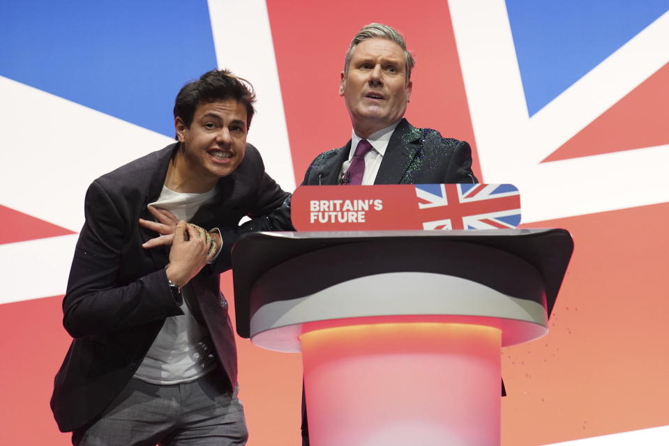 A protester disrupts Labour leader Sir Keir Starmer making his keynote speech during the Labour Party conference in Liverpool, England, Tuesday, Oct. 10, 2023. (Stefan Rousseau/PA via AP)