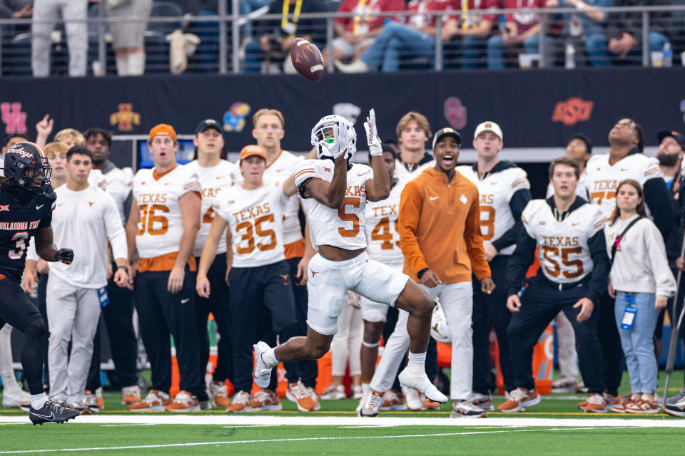 ARLINGTON, TX - DECEMBER 02: Texas Longhorns wide receiver Adonai Mitchell (#5) catches a pass during the Big 12 Championship football game between the Texas Longhorns and Oklahoma State Cowboys on December 02, 2023 at AT&T Studium in Arlington, Texas. (Photo by Matthew Visinsky/Icon Sportswire via Getty Images)