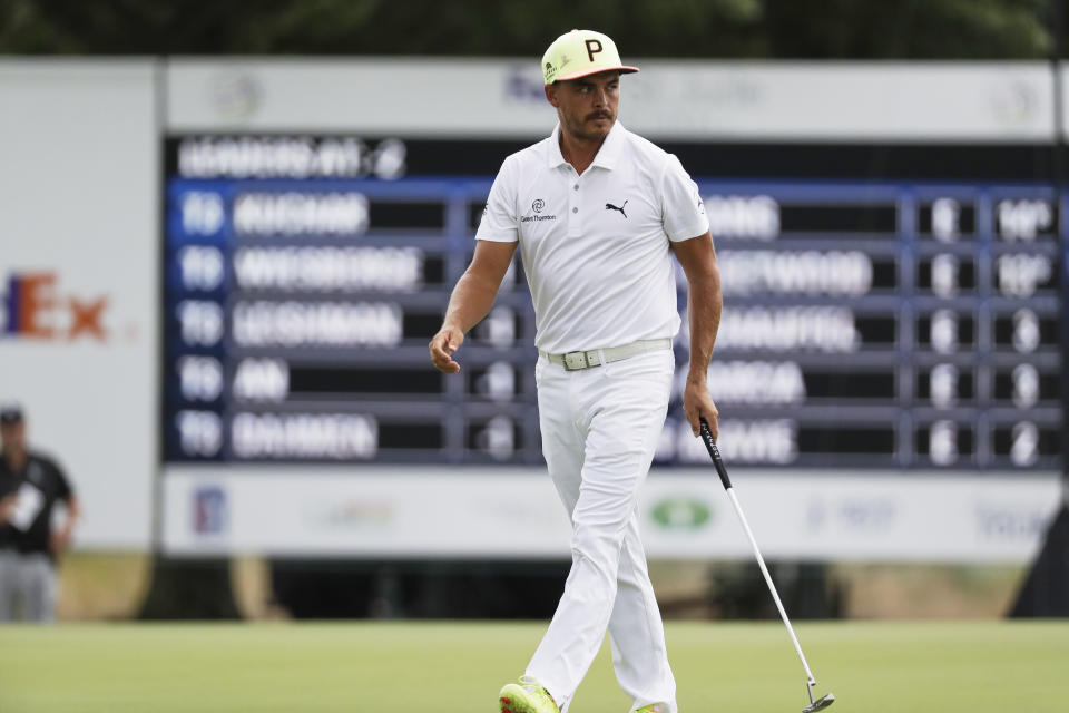 Rickie Fowler walks on the 12th green during the first round of the World Golf Championship-FedEx St. Jude Invitational Thursday, July 30, 2020, in Memphis, Tenn. (AP Photo/Mark Humphrey)