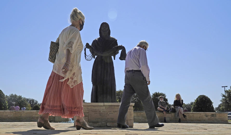 A bronze statue of Jesus Christ sits on display outside of the Prestonwood Baptist Church Sunday, Oct. 11, 2020, in Plano, Texas. Evangelical churches and their suburban members are a key to President Donald Trump's voter support in Texas. (AP Photo/LM Otero)