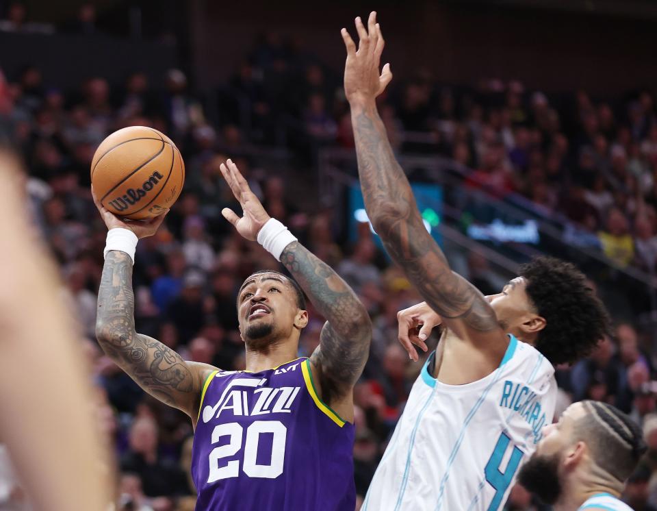 Utah Jazz forward John Collins (20) shoots by Charlotte Hornets center Nick Richards (4) in Salt Lake City on Thursday, Feb. 22, 2024. The Hornets won 115-107. | Jeffrey D. Allred, Deseret News