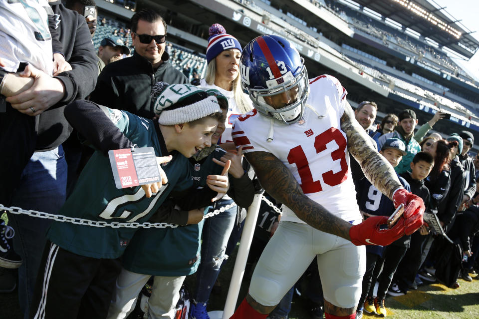 Former New York Giants wide receiver Odell Beckham poses for a photograph with fans before a game against the Eagles last season. (AP)