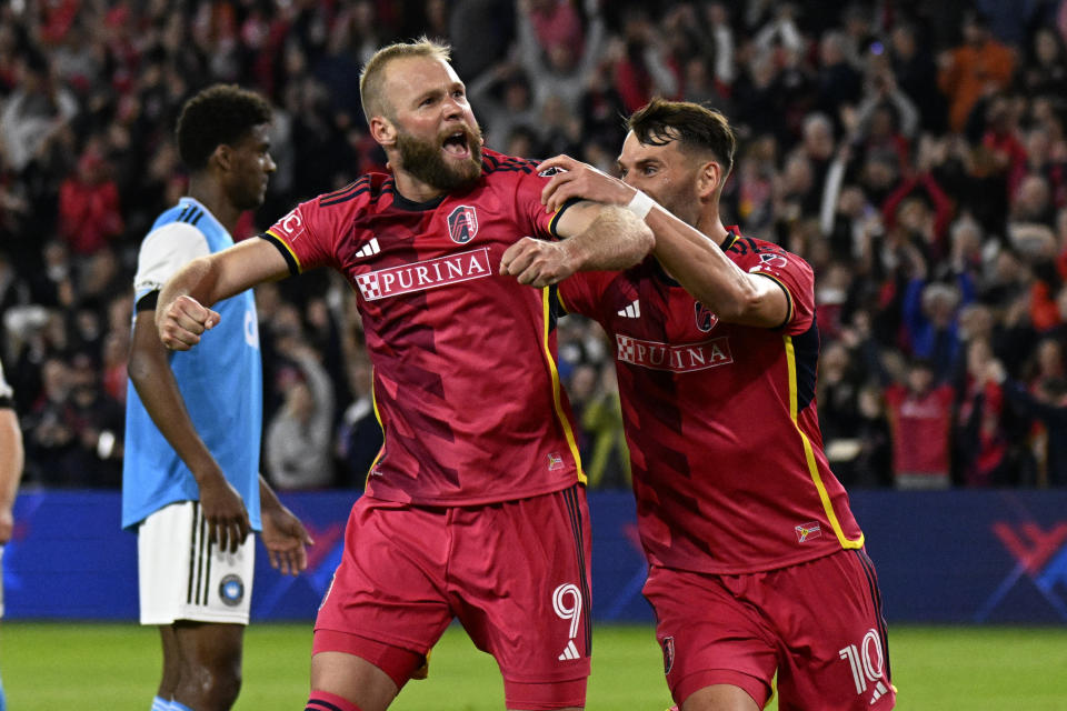 St. Louis City forward Jo&#xe3;o Klauss (9) celebrates a goal with teammate Eduard Lowen (10) in a match against Charlotte FC on March 4, 2023 in St. Louis. (Scott Rovak-USA TODAY Sports)