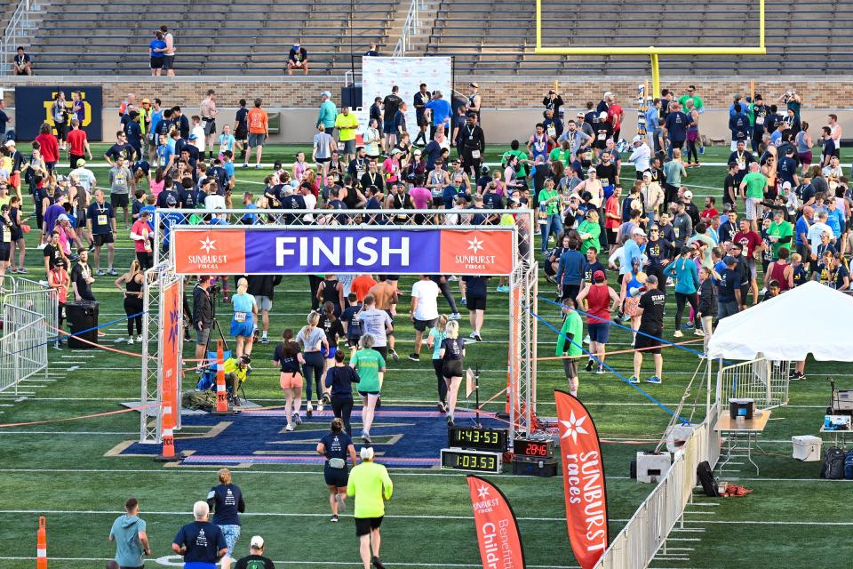 Runners finish one of the Sunburst races at Notre Dame Stadium on Saturday, June 4, 2022, in South Bend.