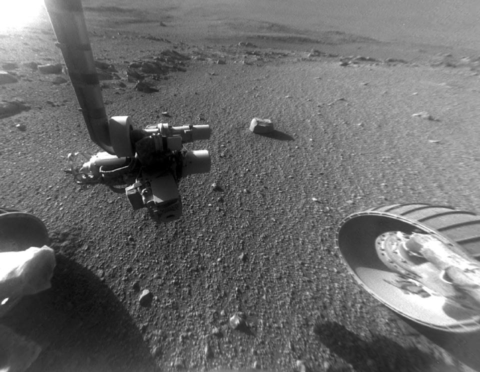 This late-afternoon view from the Mars rover Opportunity's front hazard camera, taken in January 2018, shows a pattern of rock stripes on the ground, a surprise to mission scientists. <cite>NASA/JPL-Caltech</cite>