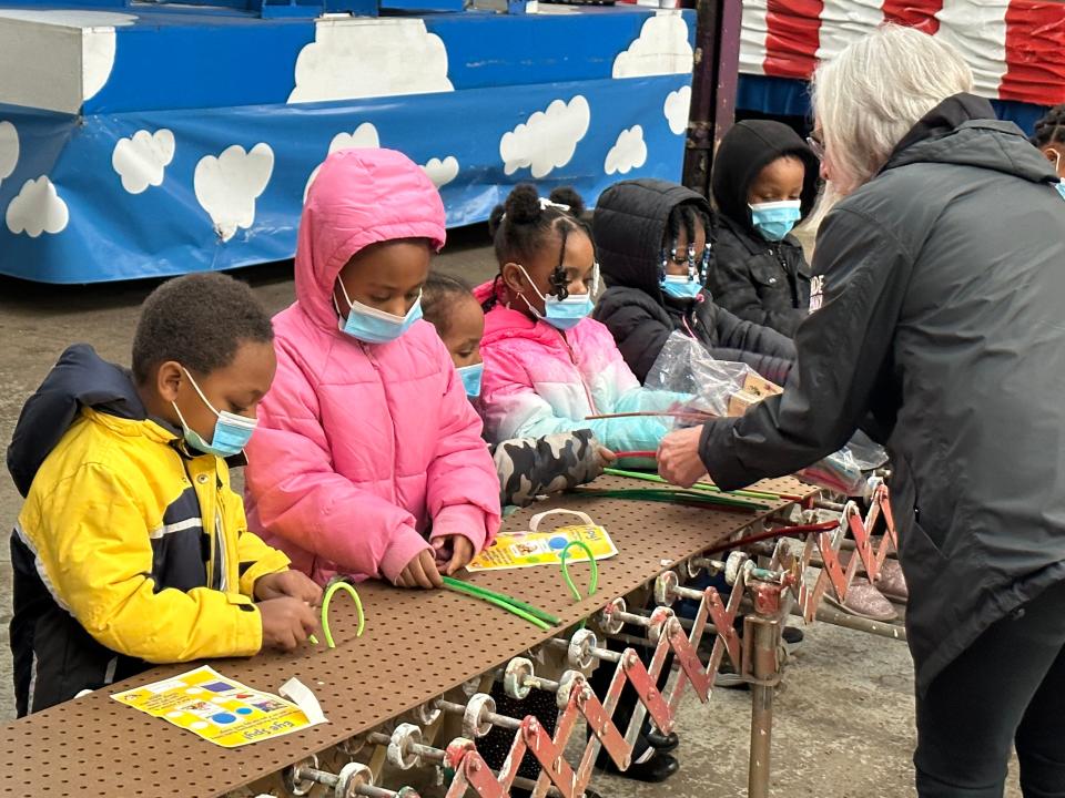 Children from Detroit make a craft at PNC's Grow Up Great event during a Parade Company field trip  Dec. 7, 2022.  Growing up great is a $500 million initiative launched in 2004 that focuses on helping underserved children gain the skills to succeed in school and life.