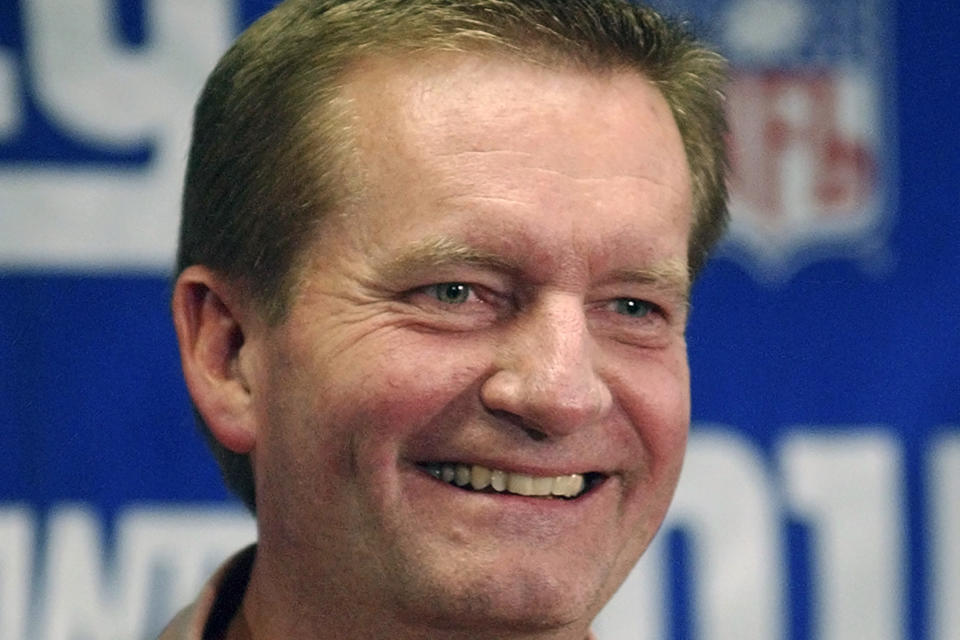 FILE - New York Giants coach Jim Fassel smiles as he talks to reporters at Giants Stadium in East Rutherford, N.J., in this Monday, Dec. 30, 2002, file photo. Fassel, a former coach of the New York Giants who was named NFL coach of the year in 1997 and led the team to the 2001 Super Bowl, has died. He was 71. Fassel's son, John, confirmed the death to the Los Angeles Times on Monday, June 7, 2021. According to the Los Angeles Times, Fassel was taken to a hospital in Las Vegas with chest pains and died of a heart attack. (AP Photo/Bill Kostroun, File)