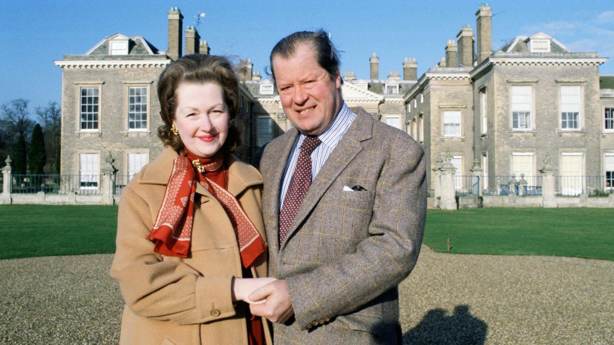 earl spencer and his wife raine in front of their home at al