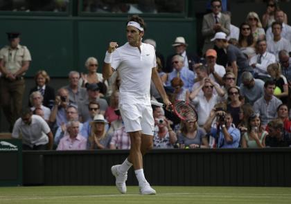 Roger Federer of Switzerland celebrates winning the men&#39;s singles semifinal match against Andy Murray of Britain, at the All England Lawn Tennis Championships in Wimbledon, London, Friday July 10, 2015. Federer won 7-5, 7-5, 6-4. (AP Photo/Pavel Golovkin)