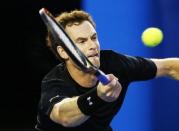 Andy Murray of Britain hits a return against Nick Kyrgios of Australia during their men's singles quarter-final match at the Australian Open 2015 tennis tournament in Melbourne January 27, 2015. REUTERS/Issei Kato