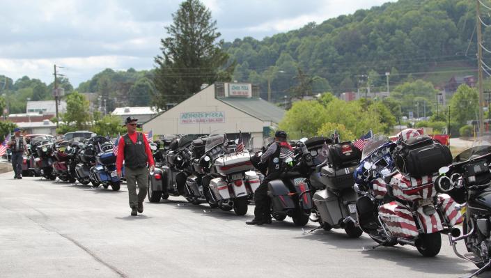 American flags dotted the convoy of motorcycles  passing through Swannanoa.