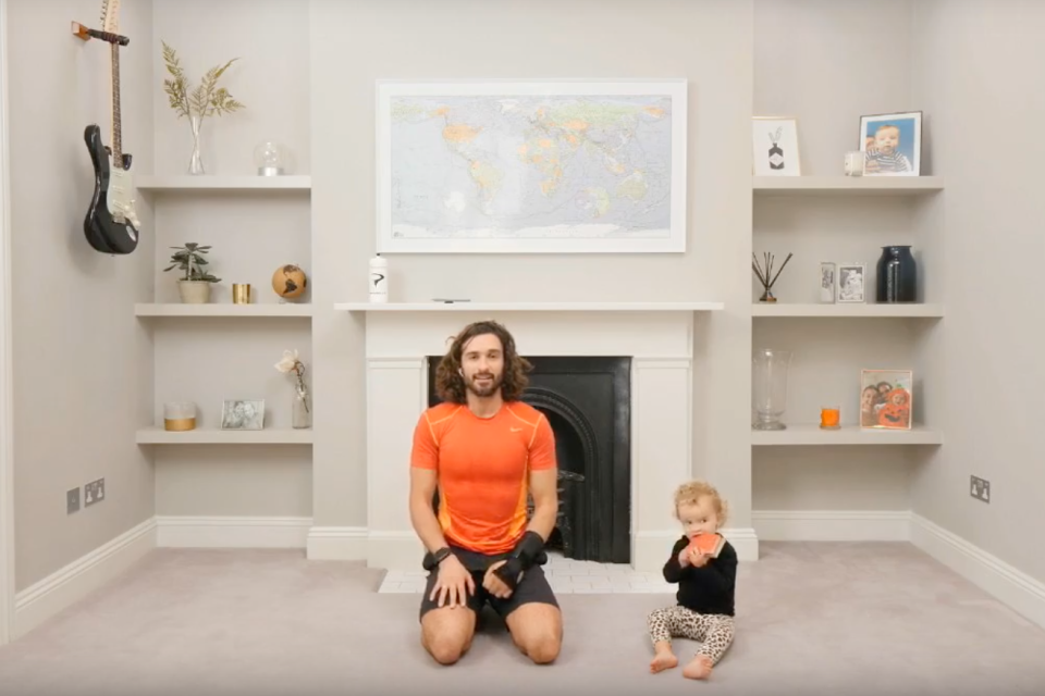 Wicks - joined here by daughter Skye - is currently streaming live daily PE lessons (Joe Wicks )