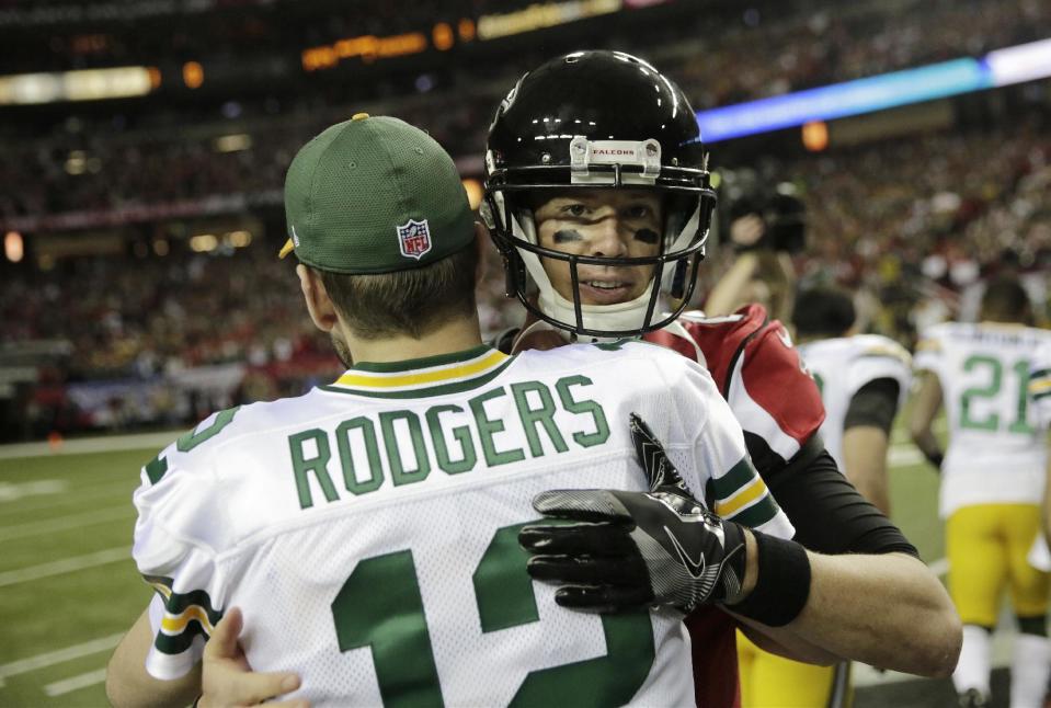 Quarterbacks Aaron Rodgers and Matt Ryan are looking at a big payday in the near future. (AP)