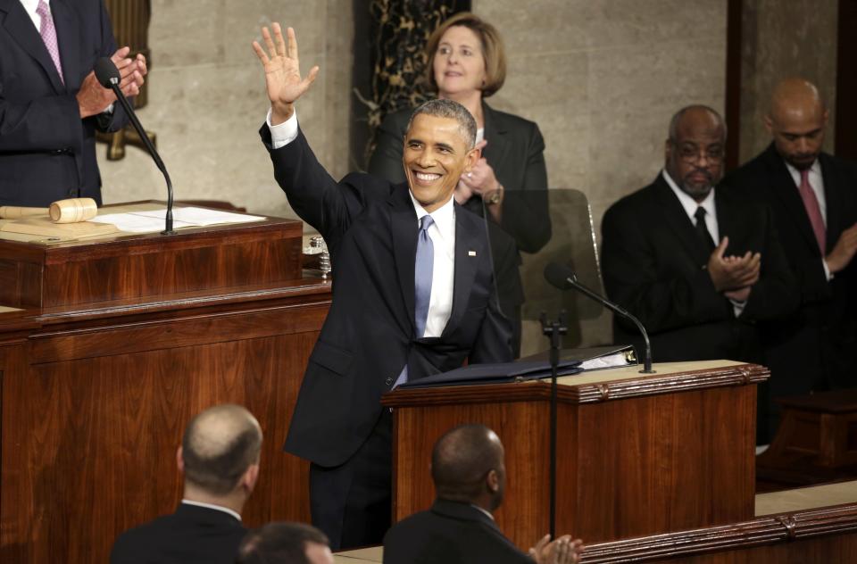 U.S. President Barack Obama waves at the start of his State of the Union address to a joint session of the U.S. Congress on Capitol Hill in Washington