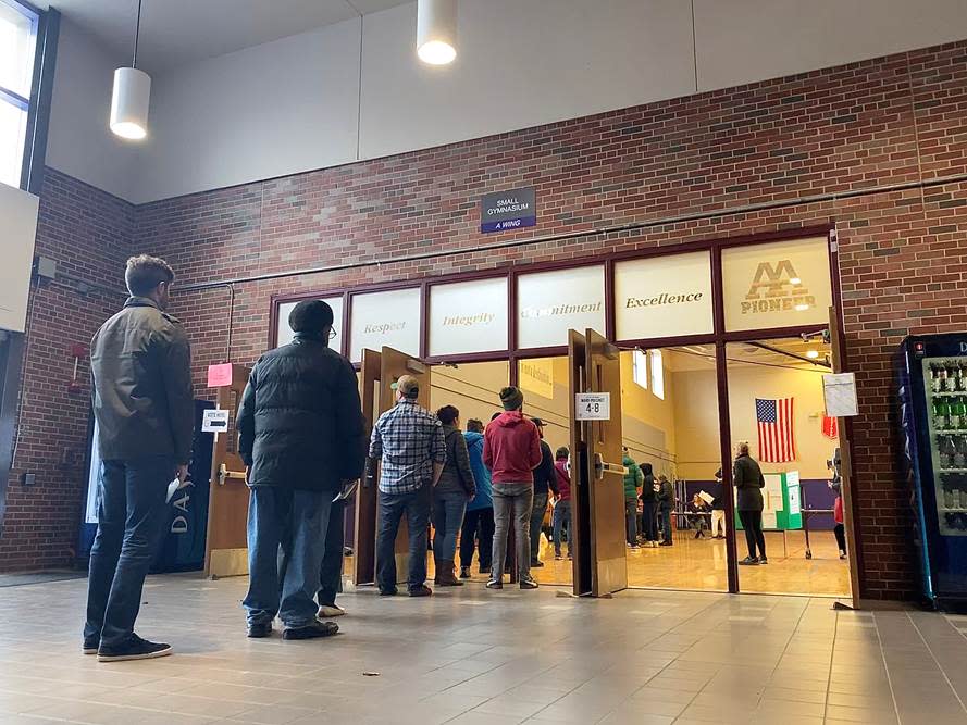 Voters line up during the presidential primary about 10:30 a.m. Tuesday, March 10, 2020,  at Pioneer High School, 601 W. Stadium Blvd. in Ann Arbor.