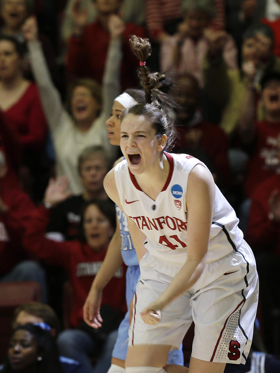 Stanford forward Bonnie Samuelson celebrates after making a 3-point basket against North Carolina during the first half of a regional final at the NCAA women's college basketball tournament in Stanford, Calif., Tuesday, April 1, 2014. (AP Photo/Marcio Jose Sanchez)