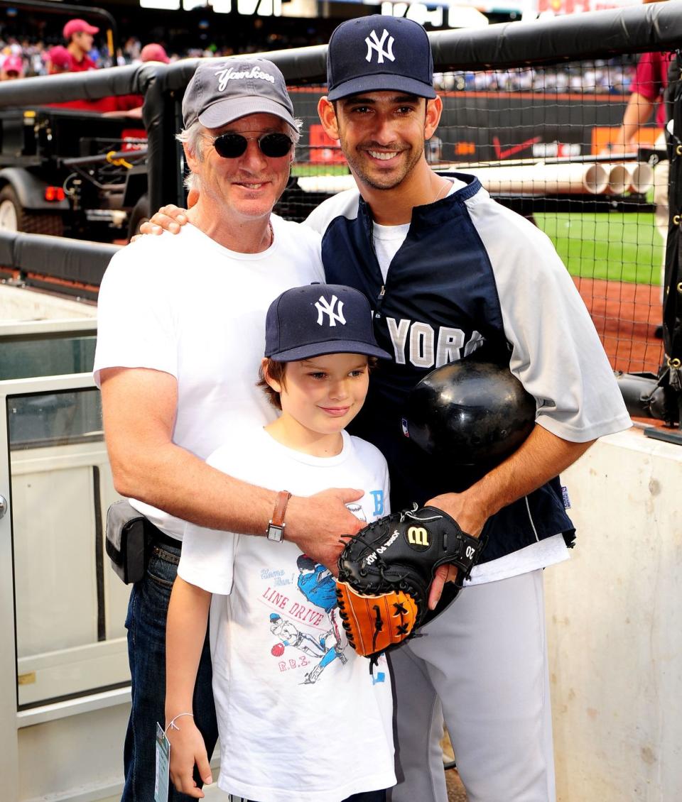 <p>Richard Gere makes a trip to the ballpark even better for his son Homer as he introduces him to New York Yankee, Jorge Posada after the game in 2009. </p>