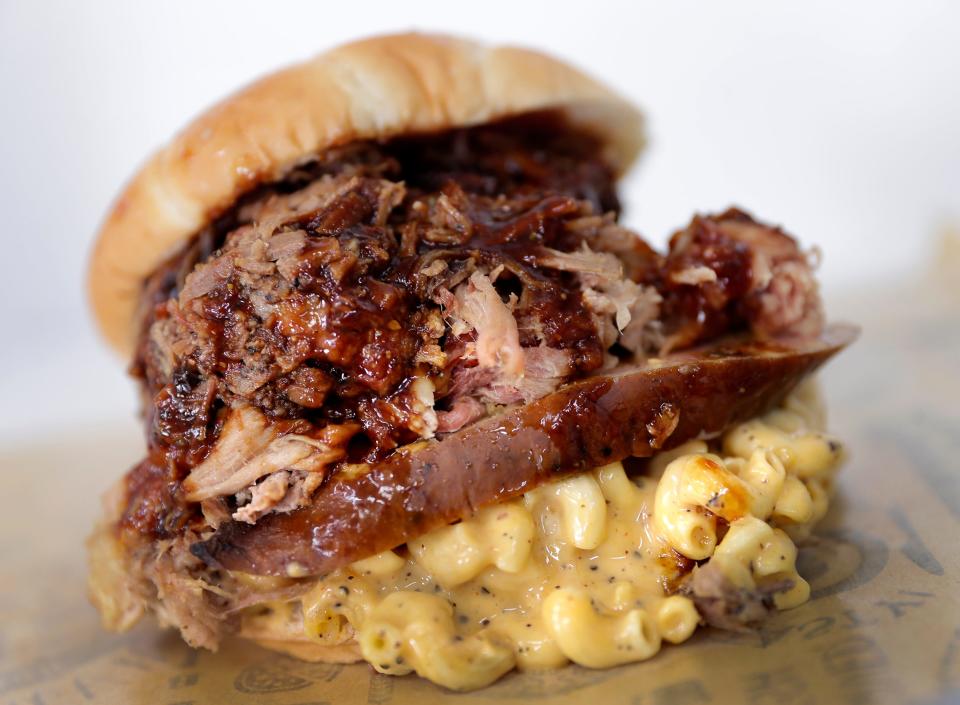 The Gravedigger, a layer of smoked mac, jalapeno cheddar sausage, brisket and pulled pork on a Manderfields steak bun at he High Kaliber food truck on Friday, April 26, 2024 in Appleton, Wis.
Wm. Glasheen USA TODAY NETWORK-Wisconsin

Seventh grade teacher Chia Lee at Wilson Middle School