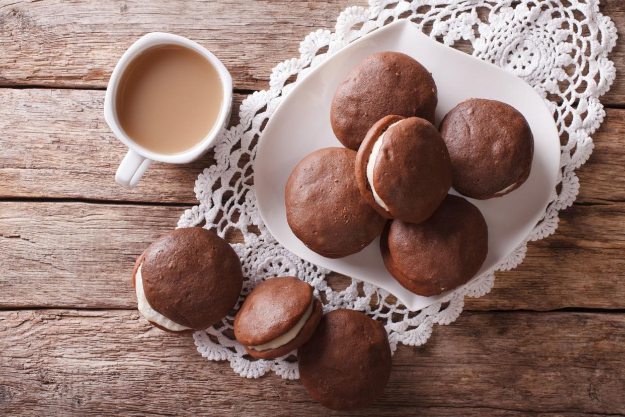 American Whoopie pie dessert and coffee on the table. horizontal view from above