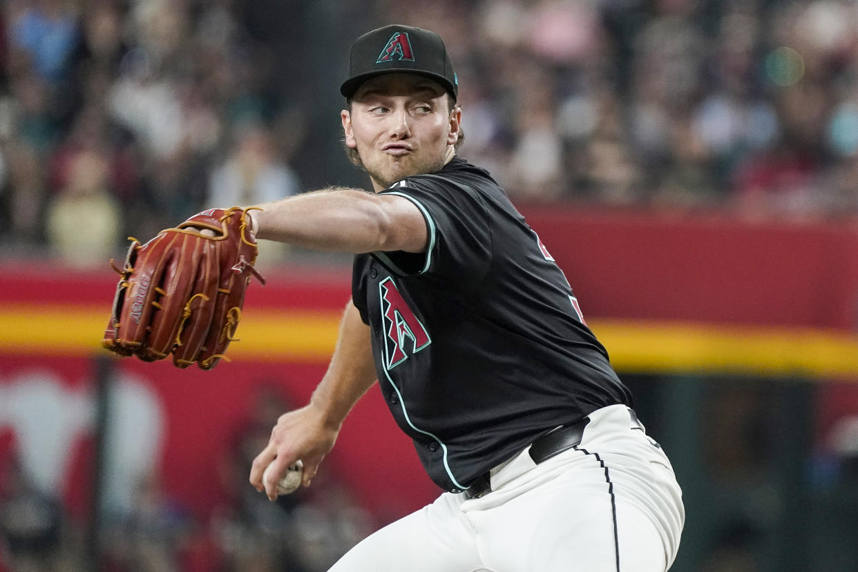 Arizona Diamondbacks pitcher Brandon Pfaadt (32) throws against the Milwaukee Brewers during the first inning of a baseball game, Saturday, Sept. 14, 2024, in Phoenix. (AP Photo/Darryl Webb)