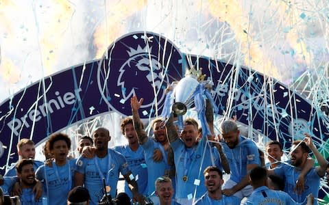 Manchester City lift the title at Brighton - Credit: Reuters