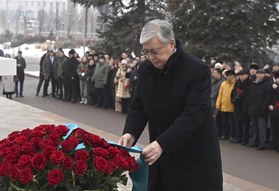 FILE - In this photo released by Kazakhstan's Presidential Press Service, Kazakhstan's President Kassym-Jomart Tokayev attends an unveiling a memorial to the hundreds of people killed amid the worst unrest in Kazakhstan's three decades of independence in January of 2022 in Republic Square, in the heart of the country's former capital Almaty, Kazakhstan, Friday, Dec. 23, 2022. Lettering on the stark concrete steles of the "Tagzym" ("Reverence") memorial spoke of the need for unity and harmony a year on from the events dubbed "bloody January." (Kazakhstan's Presidential Press Service via AP, File)