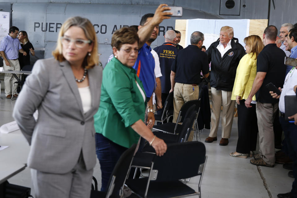 San Juan Mayor Carmen Yulin Cruz (far L) waits to greet U.S. President Donald Trump before a briefing to survey hurricane damage at Muniz Air National Guard Base in Carolina, Puerto Rico, Oct. 3, 2017. (Photo: Jonathan Ernst/Reuters)