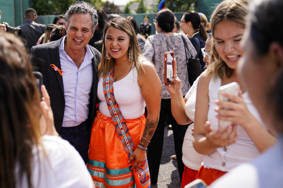 Mark Ruffalo meets with young people from the Rosebud Sioux Tribe after a ceremony at the U.S. Army's Carlisle Barracks, in Carlisle, Pa., Wednesday, July 14, 2021. The disinterred remains of nine Native American children who died more than a century ago while attending a government-run school in Pennsylvania were headed home to Rosebud Sioux tribal lands in South Dakota on Wednesday after a ceremony returning them to relatives. (AP Photo/Matt Rourke)