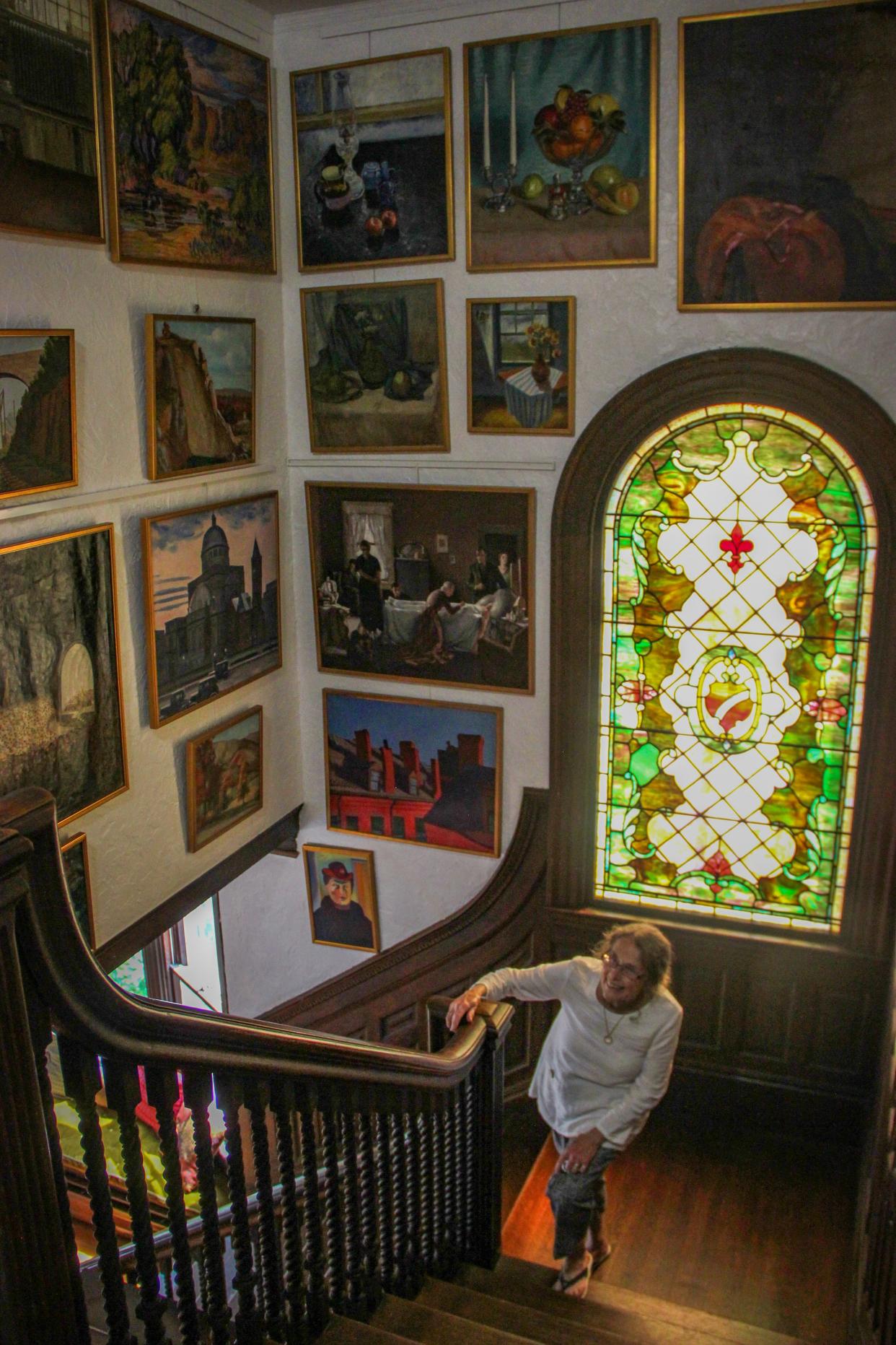 Artist and Greater Fall River Art Association board member Mary Agnes Murphy walks up the main staircase at 80 Belmont St., in this Herald News file photo.