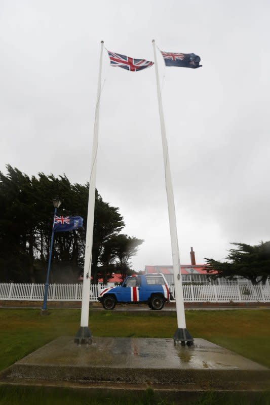 The British Union Jack (L) and the Falkland Islands flag fly side by side in Port Stanley, Falkland Islands, on March 9, 2013. On March 3, 1982, the Argentine government threatened to break off diplomatic relations with Britain if the Falkland Islands were not handed back by the following year's 150th anniversary of the British presence on the islands. File Photo by Javier Lizon/European Pressphoto Agency