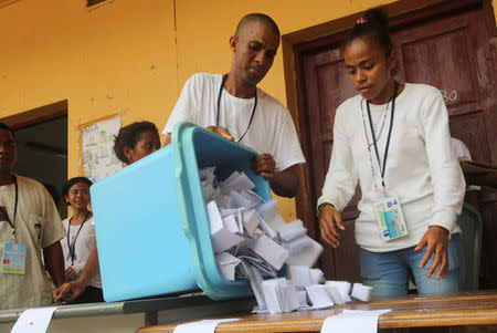 An election official empties a ballot box during the counting process of the presidential elections in Dili, East Timor March 20, 2017. REUTERS/Lirio da Fonseca