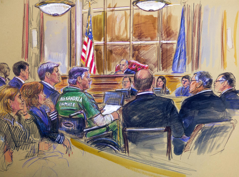 This courtroom sketch depicts former Trump campaign chairman Paul Manafort, center in a wheelchair, during his sentencing hearing in federal court before judge T.S. Ellis III in Alexandria, Va., Thursday, March 7, 2019. Manafort was sentenced to nearly four years in prison for tax and bank fraud related to his work advising Ukrainian politicians, a significant break from sentencing guidelines that called for a 20-year prison term. (Dana Verkouteren via AP)