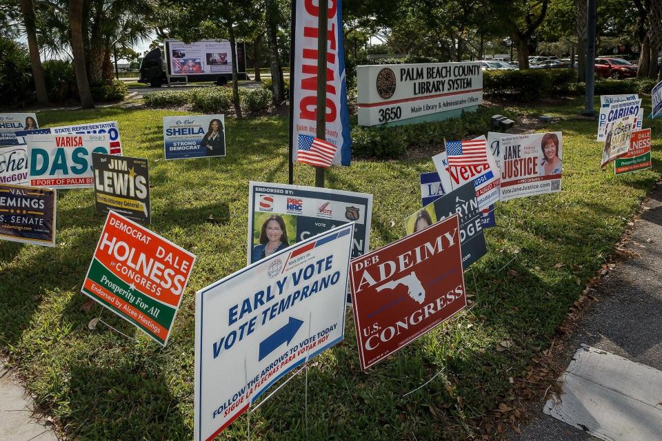 Candidate signage fills the entrance to the Palm Beach County Library System main library and administrative offices early voting hours in unincorporated Palm Beach County, Fla., on August 20, 2022.