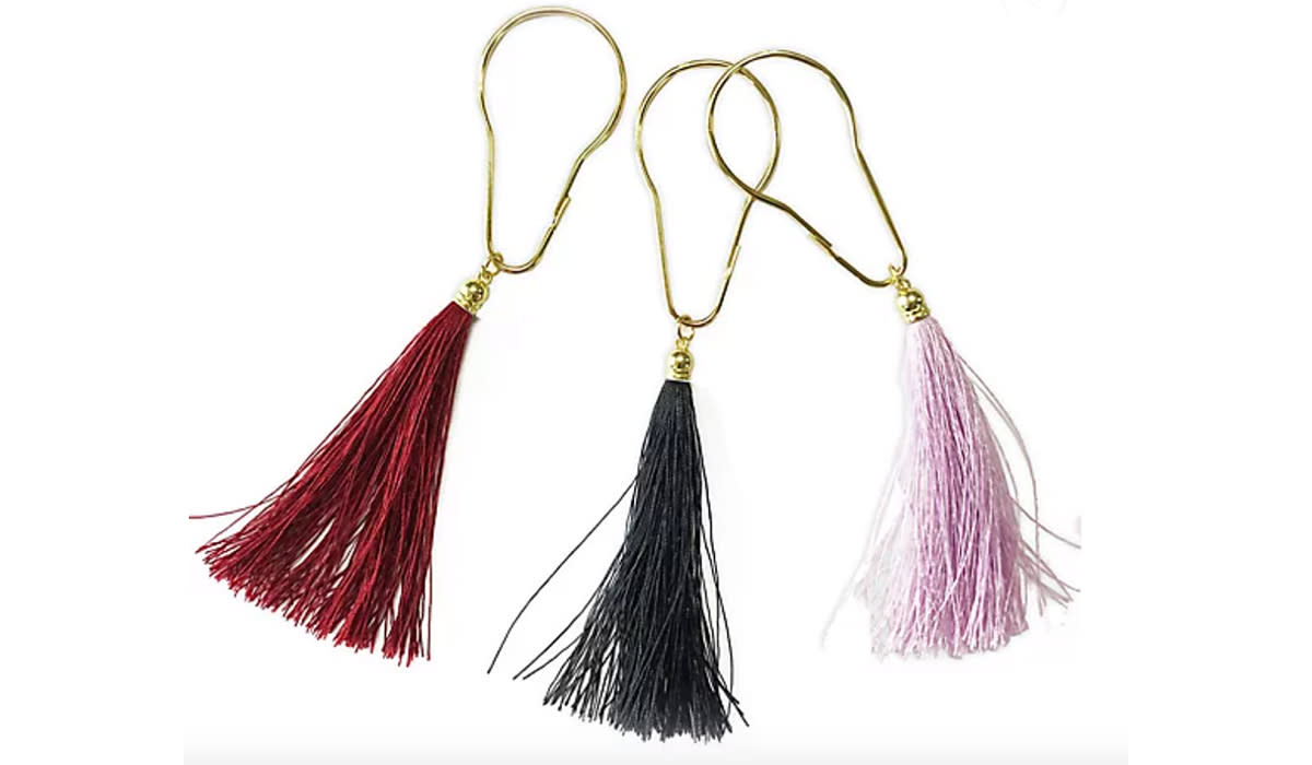 Tassel-adorned shower curtain hooks