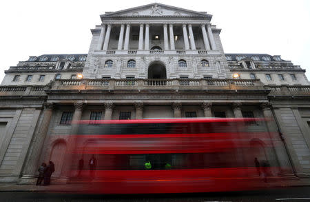 FILE PHOTO: A bus passes the Bank of England in London, Britain, April 9, 2018. REUTERS/Hannah McKay/File Photo