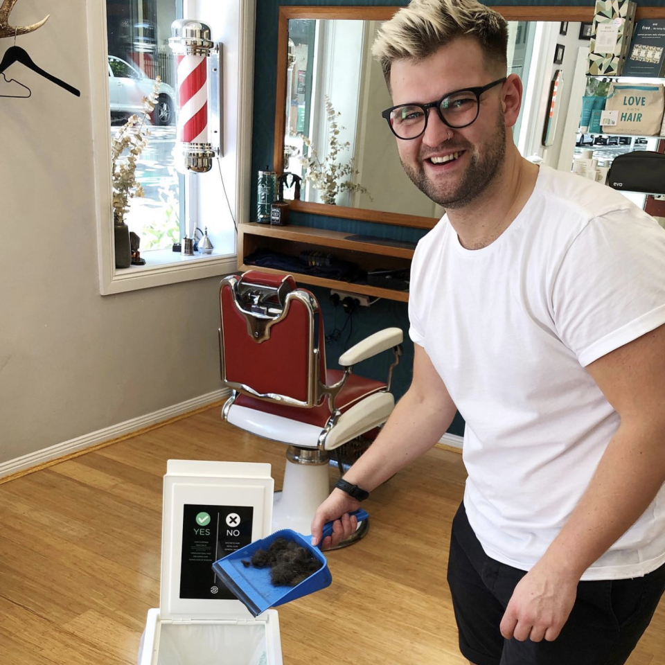 An employee at the Surry Hills store adding hair to one of their collection bins. Source: Supplied