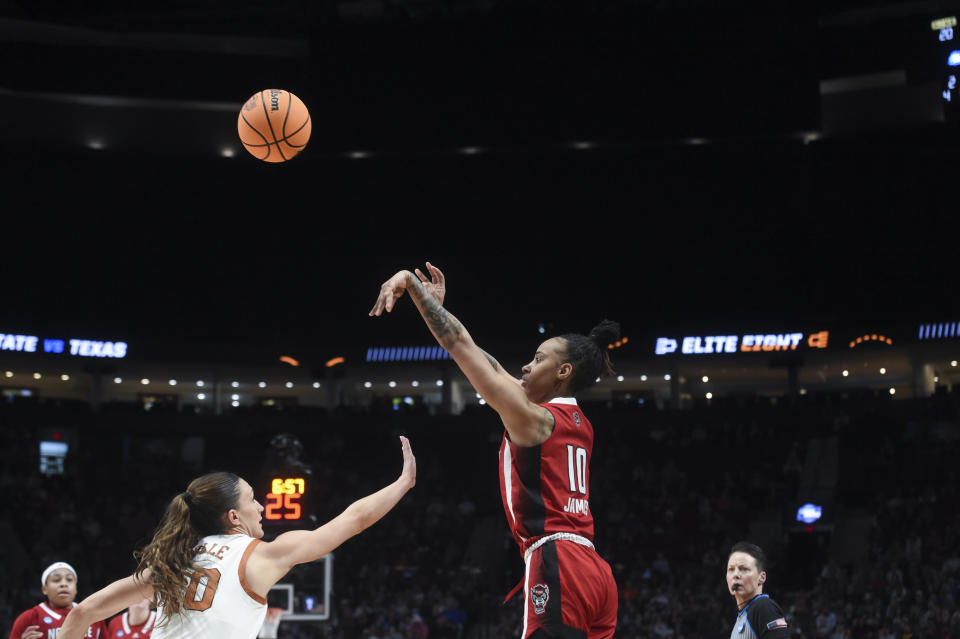 North Carolina State guard Aziaha James (1) shoots as Texas guard Shay Holle defends during the first half of an Elite Eight college basketball game in the women's NCAA Tournament, Sunday, March 31, 2024, in Portland, Ore. (AP Photo/Steve Dykes)