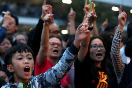 Supporters of Chief Executive candidate and former Financial Secretary John Tsang shout during a campaign rally in Hong Kong, China March 24, 2017. REUTERS/Tyrone Siu