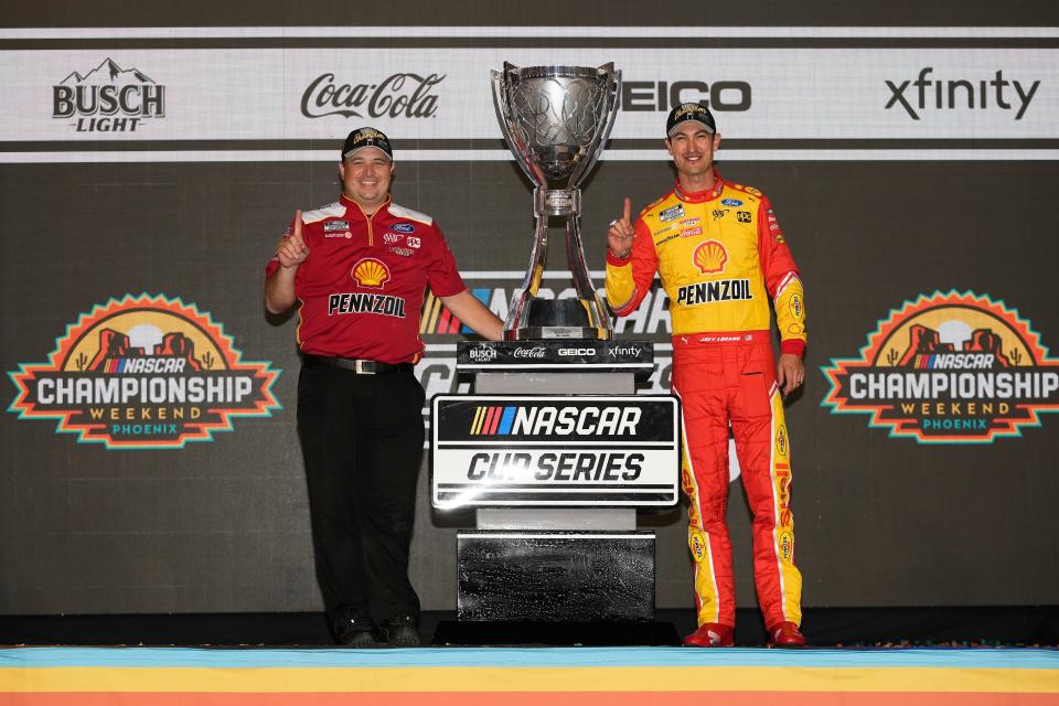 Asheville native Coleman Pressley, left, poses with NASCAR Cup Series driver Joey Logano after winning the 2022 NASCAR Cup Series championship.