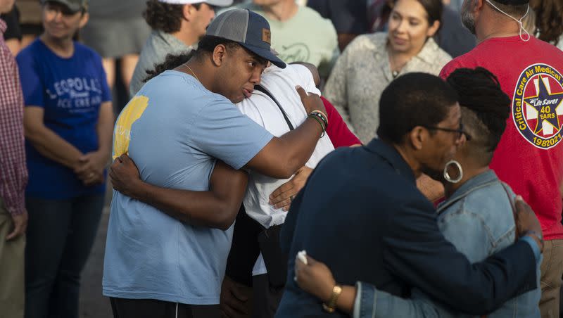 Community members embrace during a prayer vigil at First Baptist Church in Dadeville, Ala., on Sunday, April 16, 2023. A deadly shooting happened late Saturday night at Mahogany Masterpiece dance studio in downtown Dadeville.