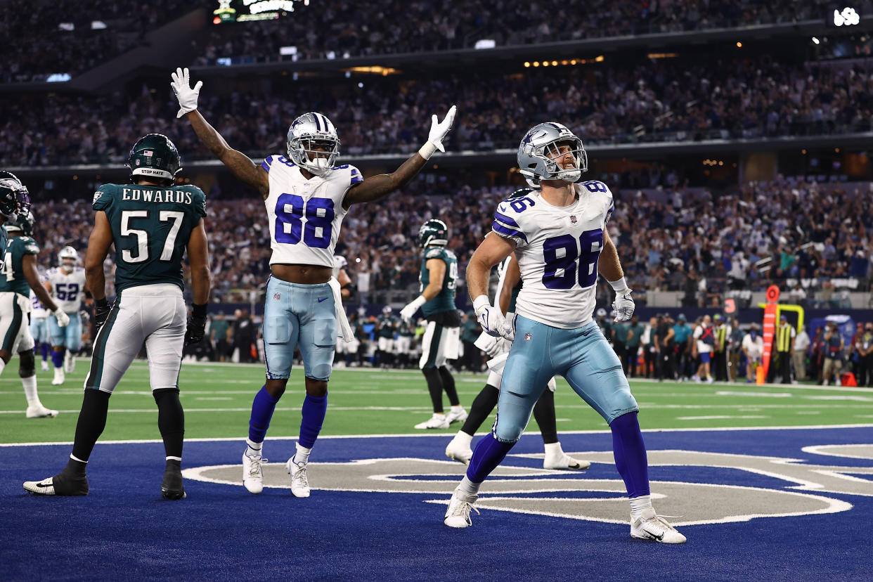 ARLINGTON, TEXAS - SEPTEMBER 27: Dalton Schultz #86 of the Dallas Cowboys celebrates his second half touchdown with CeeDee Lamb #88 while playing the Philadelphia Eagles at AT&T Stadium on September 27, 2021 in Arlington, Texas. (Photo by Tom Pennington/Getty Images)