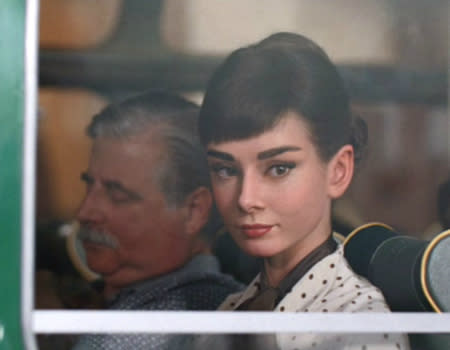 Could it be that the legendary Audrey Hepburn is still alive, 20 years after her supposed death? UK chocolate company Galaxy have featured a walking, human-like Audrey in their latest advertisement released just 3 days ago – all through CGI. The commercial shows the star stuck in traffic on a bus when she sees a handsome man in a Mercedes convertible and jumps into his car. The advert is set along Italy’s Amalfi Coast in the 1950s and plays Audrey’s “Moon River” in the background. Audrey’s sons have approved of the advert and stated that their mother indeed had a “love of chocolate”.