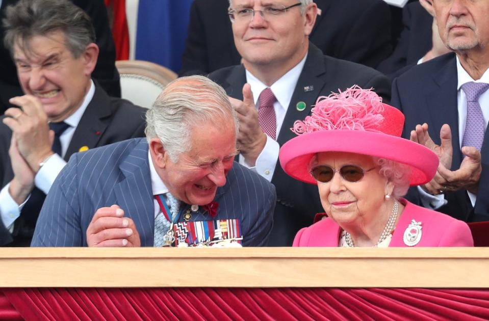 Prince Charles reacts as he sits with his mother Britain's Queen Elizabeth II during an event to commemorate the 75th anniversary of the D-Day landings, in Portsmouth in 2019 (AFP via Getty Images)