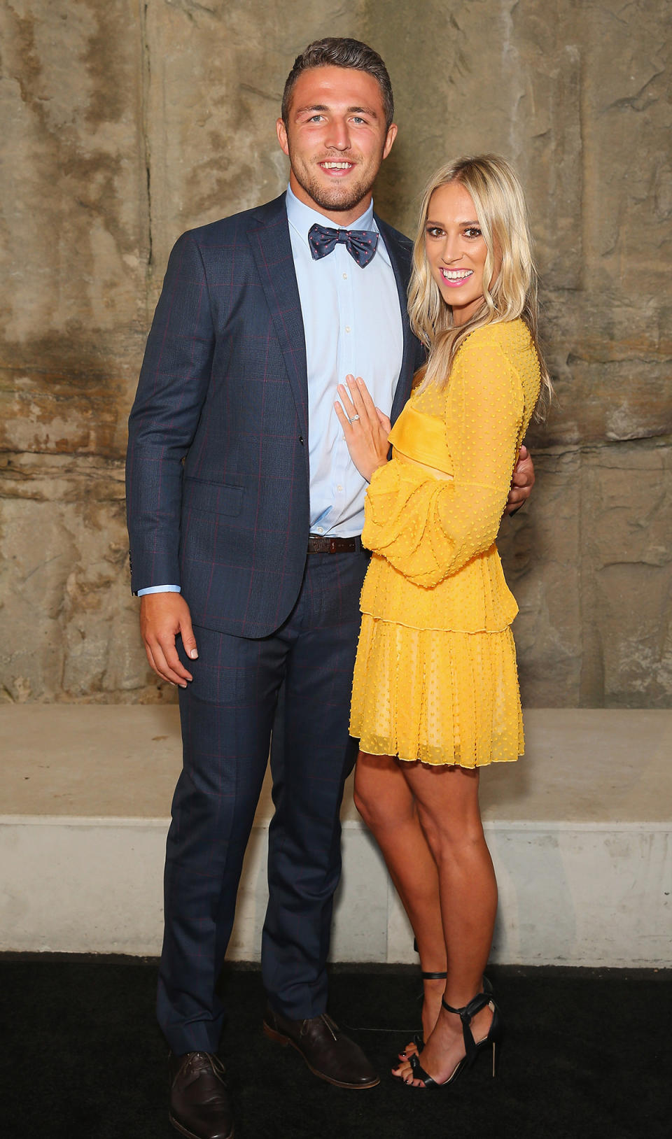 Sam Burgess and Phoebe Burgess at an event