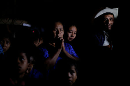 Friends and family members attend a service for Jakelin Caal, a 7-year-old girl who handed herself in to U.S. border agents earlier this month and died after developing a high fever while in the custody of U.S. Customs and Border Protection, at her home village of San Antonio Secortez, Raxruha in Guatemala December 24, 2018. REUTERS/Carlos Barria