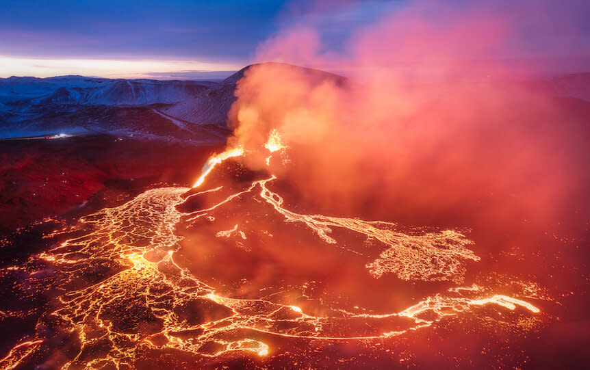 Aerial view of volcano against sky at night in Grindavik,Iceland