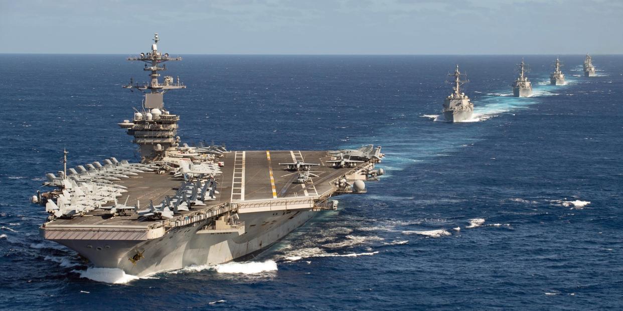 he Theodore Roosevelt Carrier Strike Group (CSG) steams in formation while transiting the Pacific