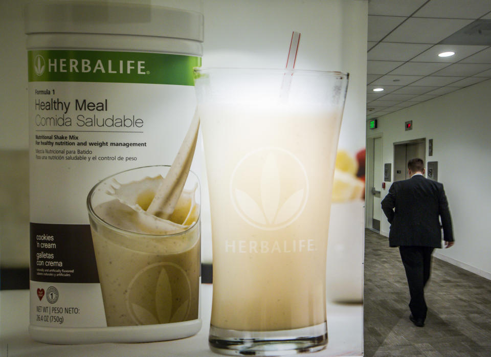 FILE- This May 11, 2016, file photo shows an area of the Herbalife corporate office in Los Angeles. Some distributors who claim they were duped by Herbalife’s promises they’d get rich selling health and personal care products are suing the company for as much as $1 billion in damages. (AP Photo/Damian Dovarganes, File)